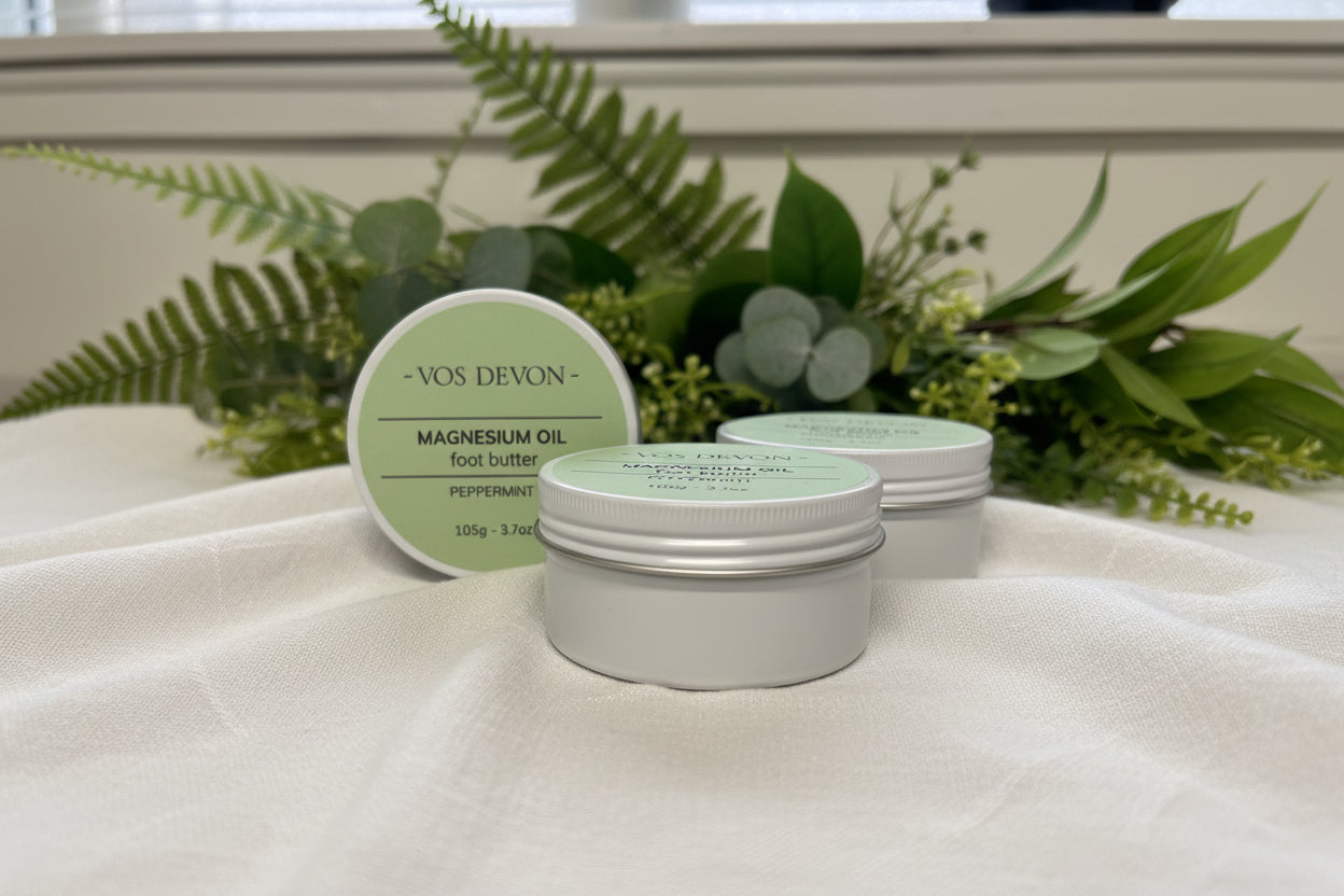 Three containers of Vos Devon magnesium oil foot butter on a white surface.