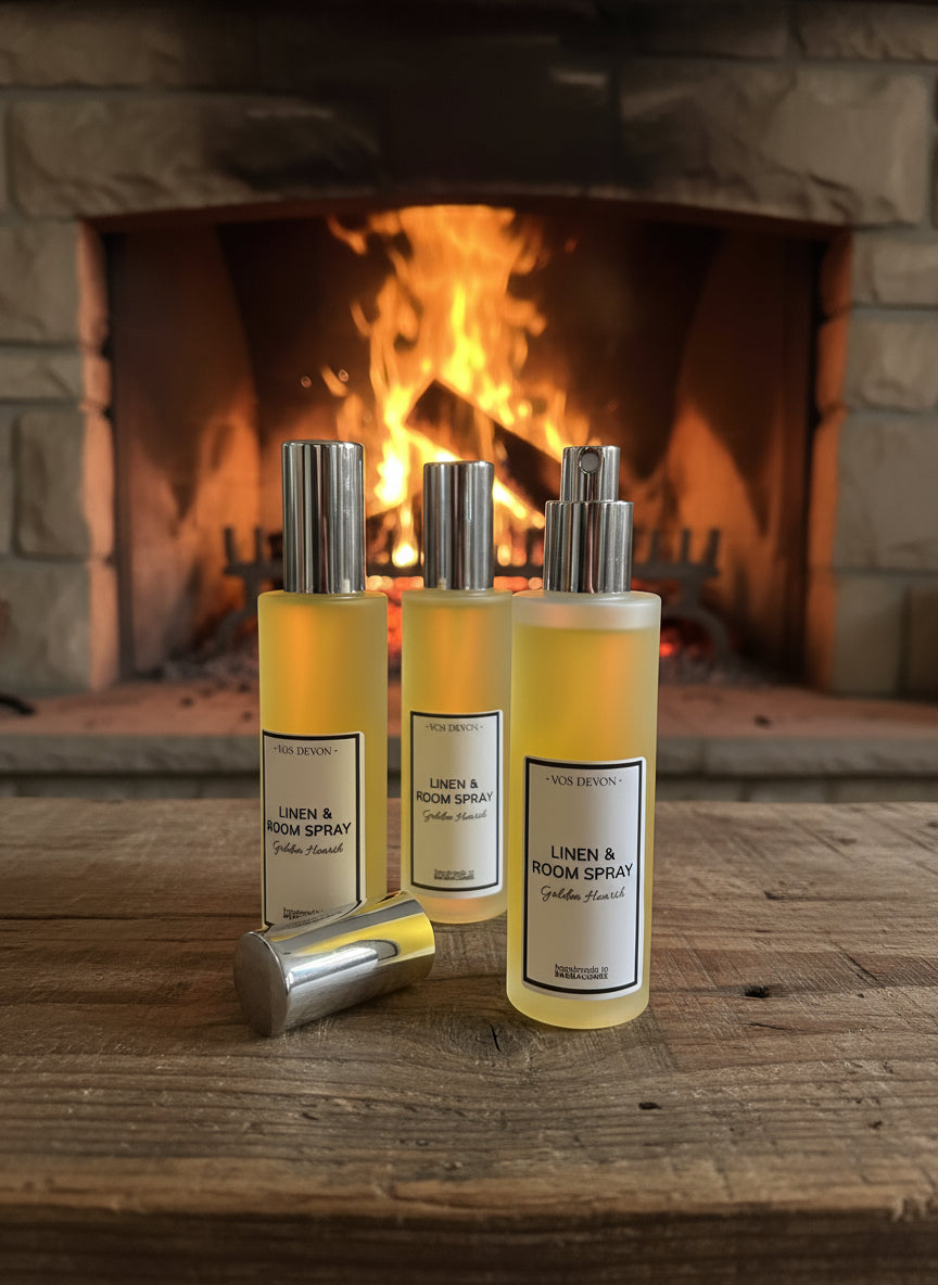 Three bottles of 'Linen & Room Spray' by 'VOS DEVON' on a white background